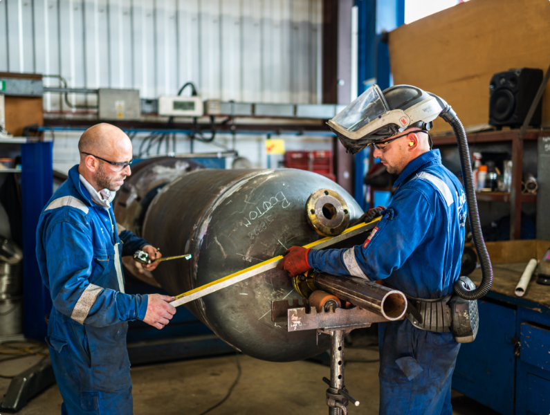 Two Puma Engineers with a level