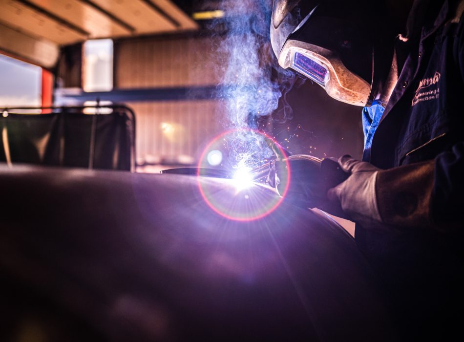 A Puma Engineer welds with lens flare